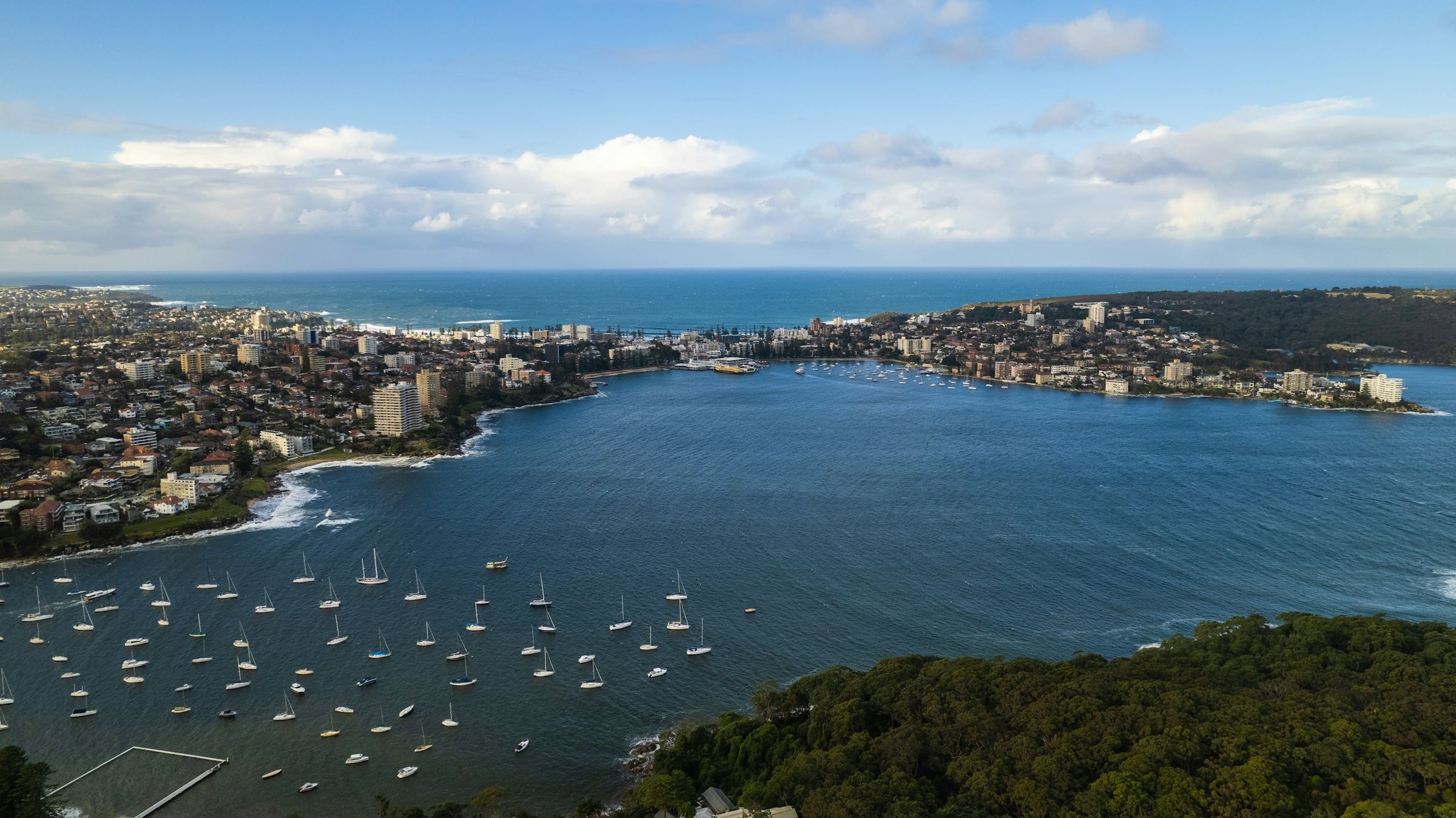 Manly Cove from above, boats moored in the harbour